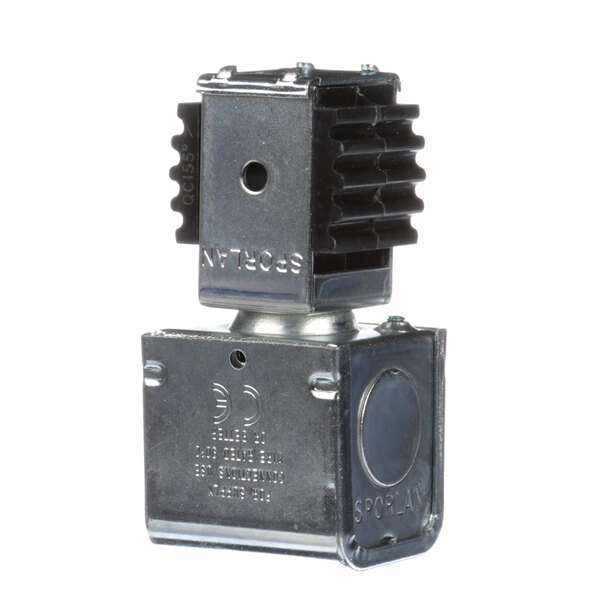 A close-up of a Delfield 3516053 metal solenoid coil with a black cover.