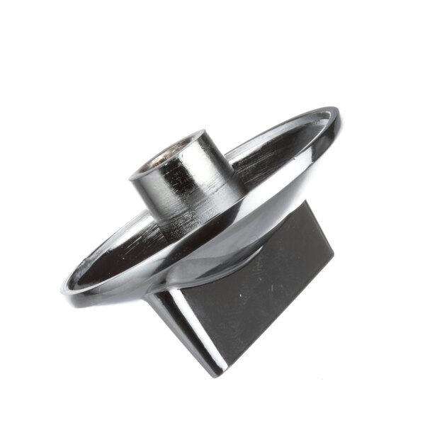 A close-up of a black and silver metal Garland range blade knob.