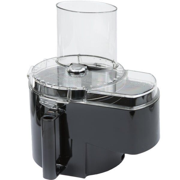 A black and clear Waring food processor chute, cover, slinger, and plunger set.