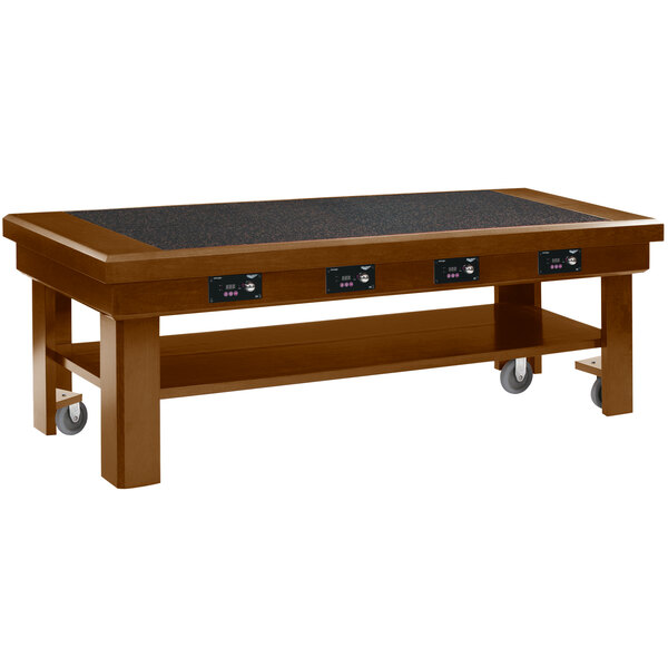 A wooden Vollrath induction buffet table with wheels.