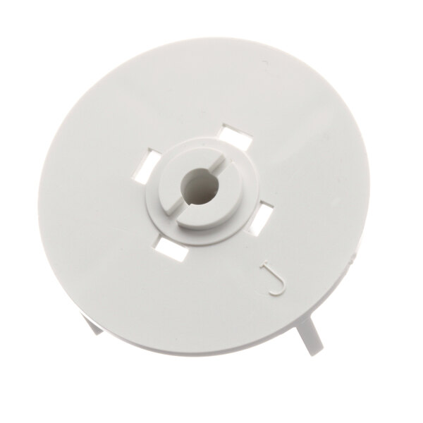 A white plastic disc with holes.