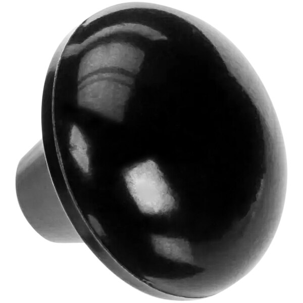 A close-up of a black round Bakers Pride knob on a white background.