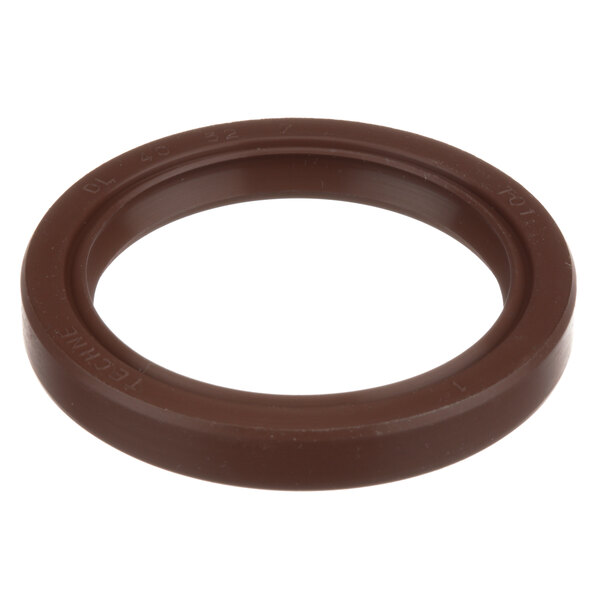 A brown round rubber lip seal with text.