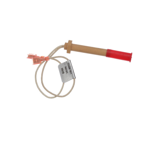 A Blodgett ignitor generator with red and white plastic pipes and a brown tube with a red cap.