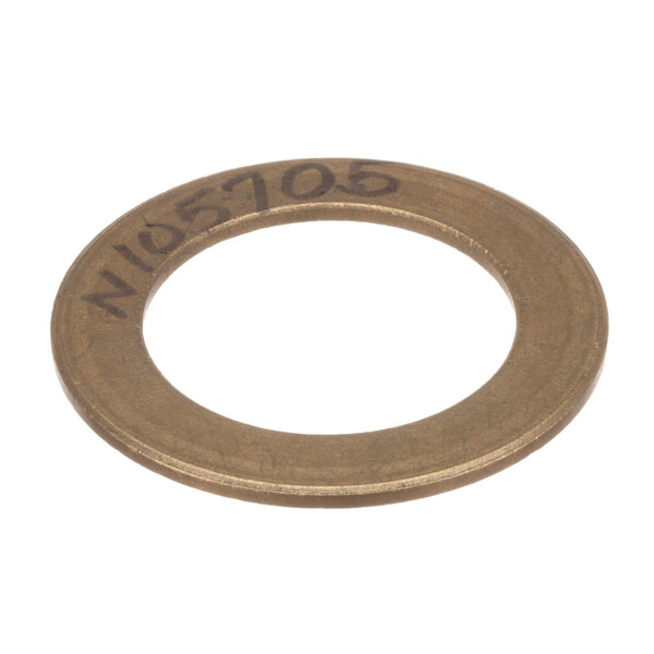 A bronze thrust washer with a white circle in the center.