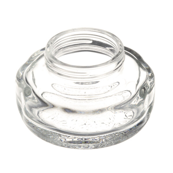 A clear glass jar with a flat lens on top.