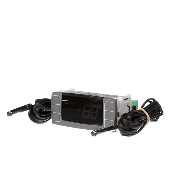 A Randell digital temperature controller with wires on a counter.