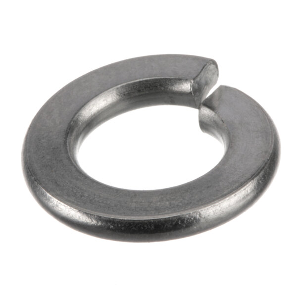 A close-up of a metal ring washer with a hole in it.