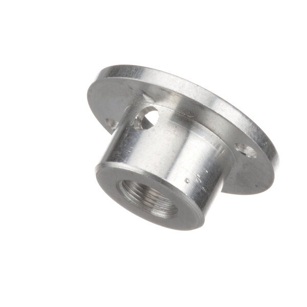 An Edlund pushbutton adapter with a hole in a silver metal nut.
