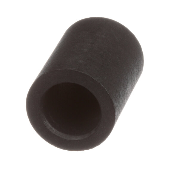 A close-up of a black cylinder with a hole in it.