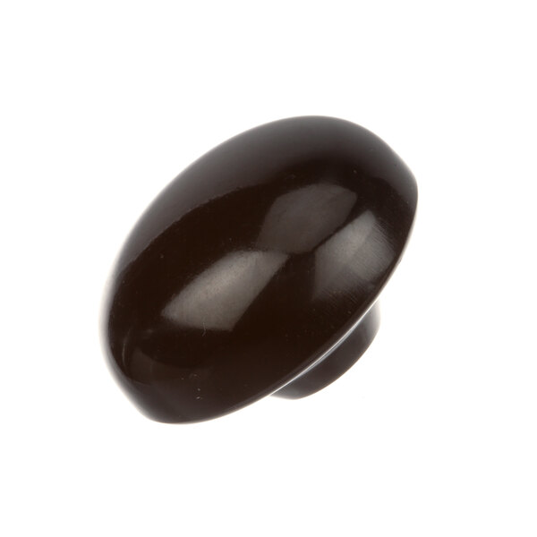 A close-up of a black knob.
