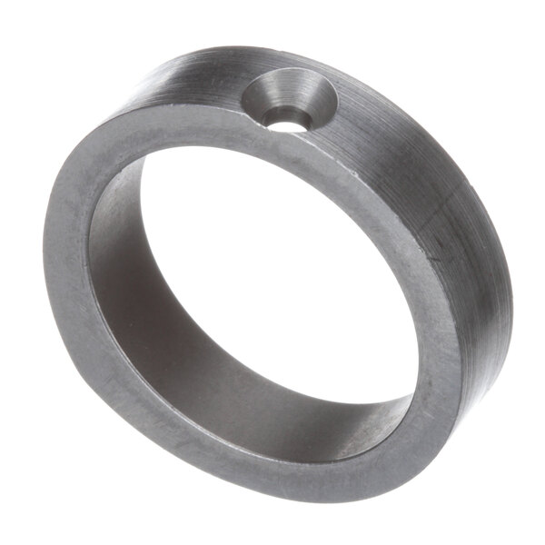 A silver circular metal ring with a hole.