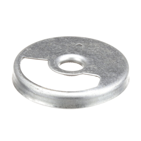 A US Range air shutter, a round metal disc with a hole in the center.