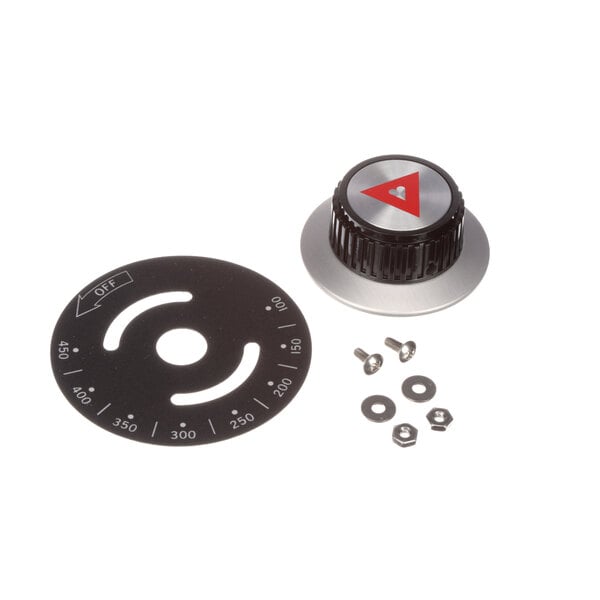 A black and silver circular knob with a triangle and screws.