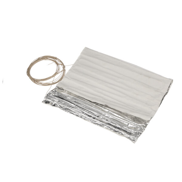 A silver foil wrapped Alto-Shaam heating pad with a wire.
