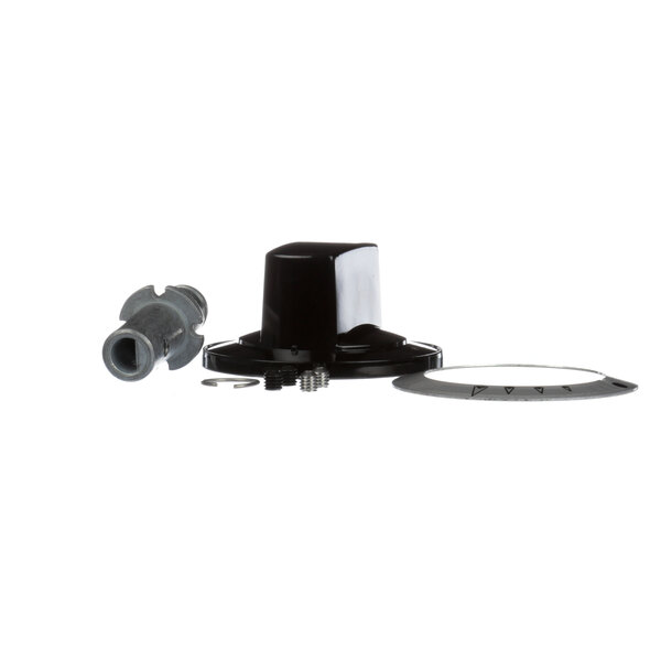 A black plastic Garland range knob with a nut and bolt.