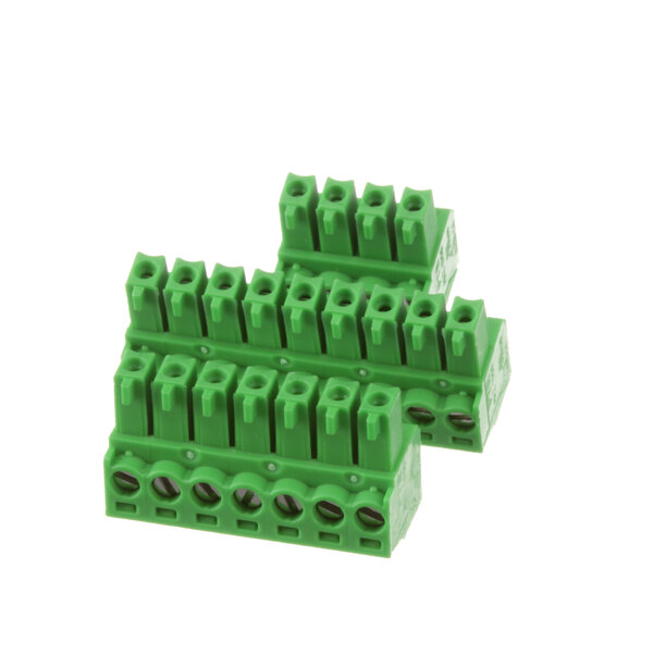 A close-up of a group of green electrical connectors.