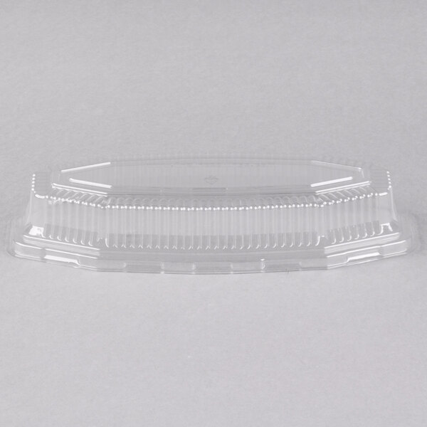 A Fineline clear PET plastic serving boat dome lid on a clear plastic container.