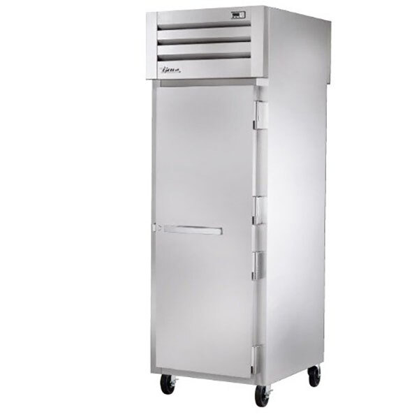 A True stainless steel pass-through refrigerator with a white door and handle.