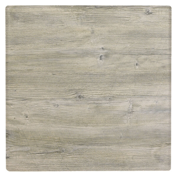A Grosfillex VanGuard white oak resin table top with a wood surface.
