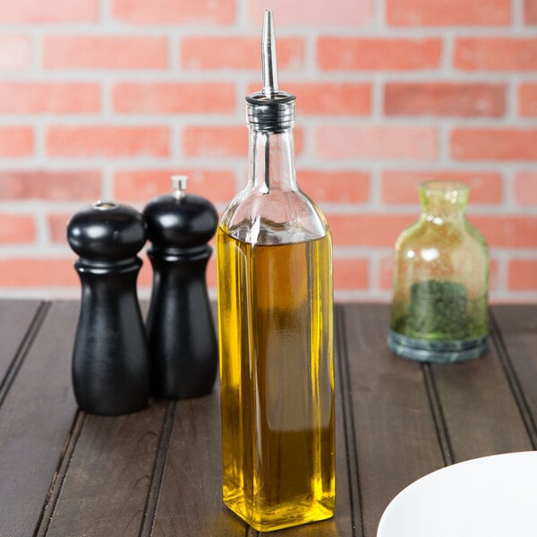 A Choice oil and vinegar cruet on a table in an Italian restaurant.