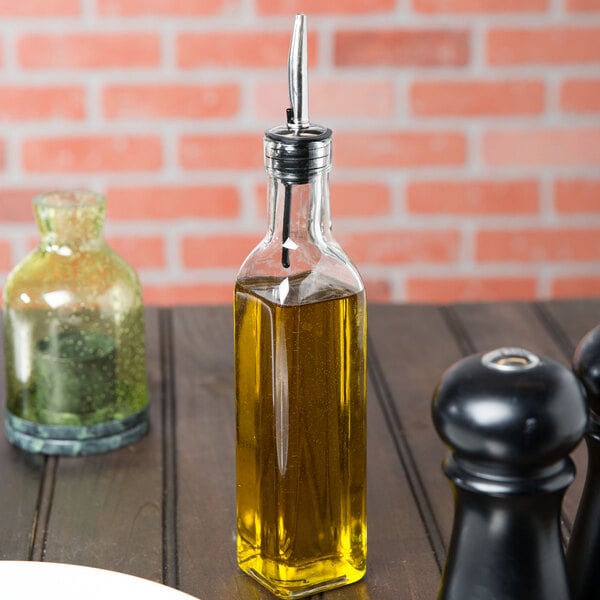 A Choice oil and vinegar cruet on a table.
