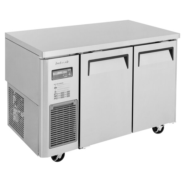 A Turbo Air stainless steel undercounter refrigerator with two solid doors.
