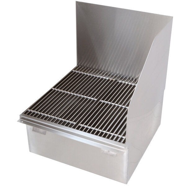A stainless steel floor mounted mop sink drain with a grate.