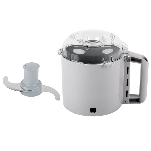 A Robot Coupe cutter bowl kit with a white plastic lid and a silver blade.
