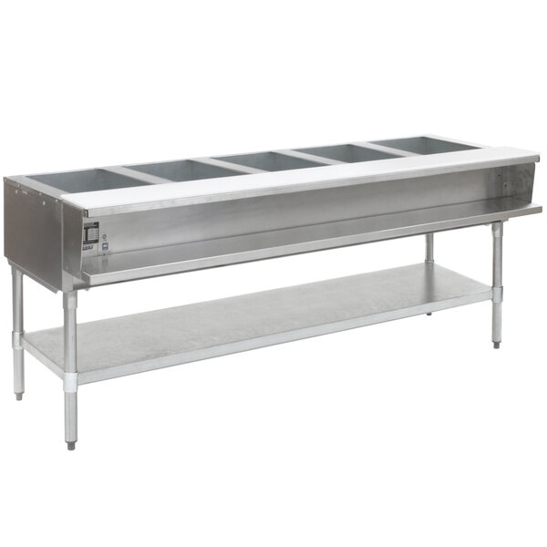 An Eagle Group stainless steel liquid propane steam table with five sealed wells on stainless steel legs.