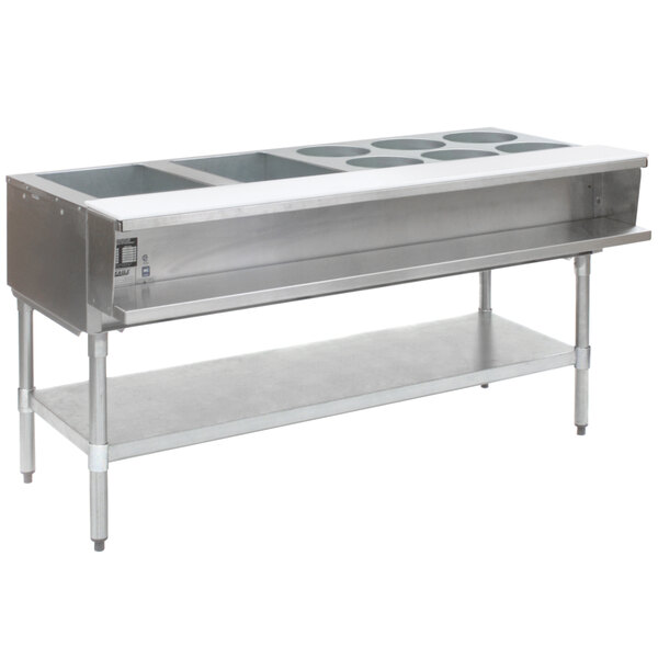An Eagle Group stainless steel natural gas steam table with galvanized legs holding eight pans of hot water on a counter.