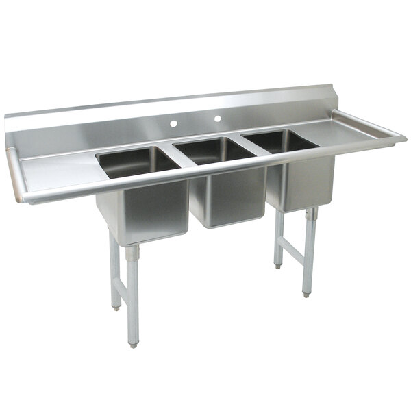 A close-up of an Advance Tabco stainless steel convenience store sink with three compartments and two drainboards.