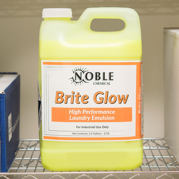 A yellow Noble Chemical Brite Glow container on a shelf.