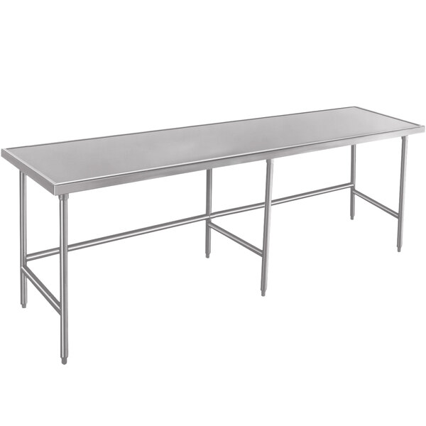 A long rectangular Advance Tabco stainless steel work table with metal legs.