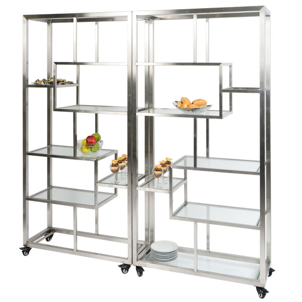 A stainless steel rolling buffet serving cart with clear acrylic shelves.