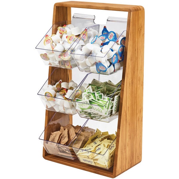 A wooden Cal-Mil coffee condiment shelf with plastic bins holding different items.