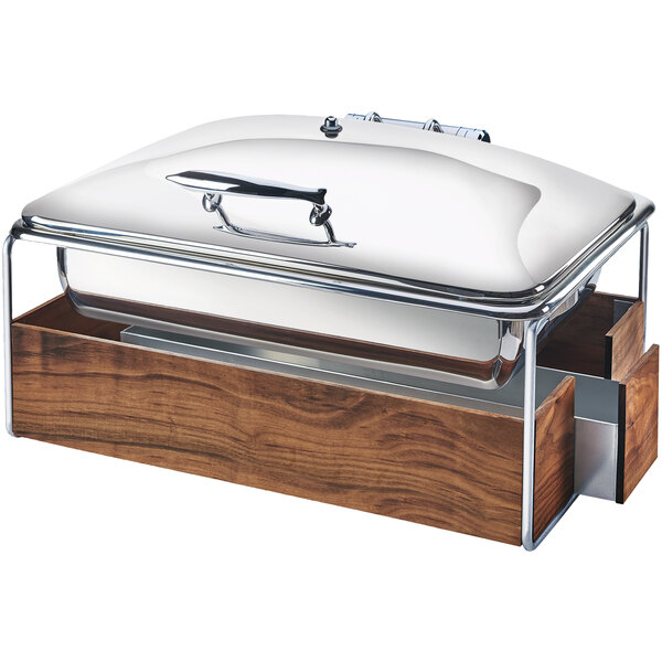 A Cal-Mil mid-century full size chafer with a walnut and chrome frame on a table with a rectangular wooden lid.