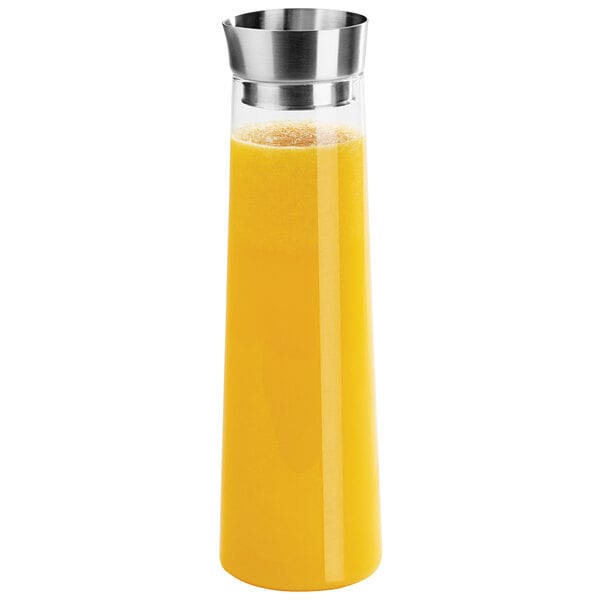 A Cal-Mil clear polycarbonate carafe with a yellow liquid inside.