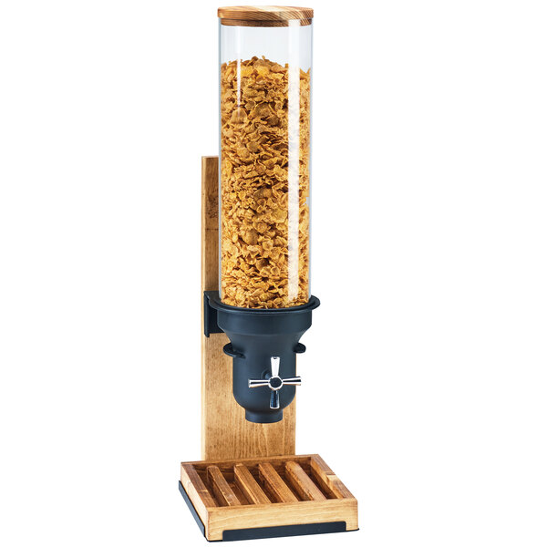 A Cal-Mil Madera cereal dispenser with a wooden stand holding cereal.