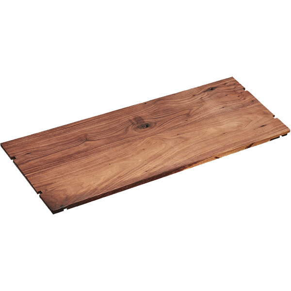 A brown walnut rectangular riser shelf on a table.
