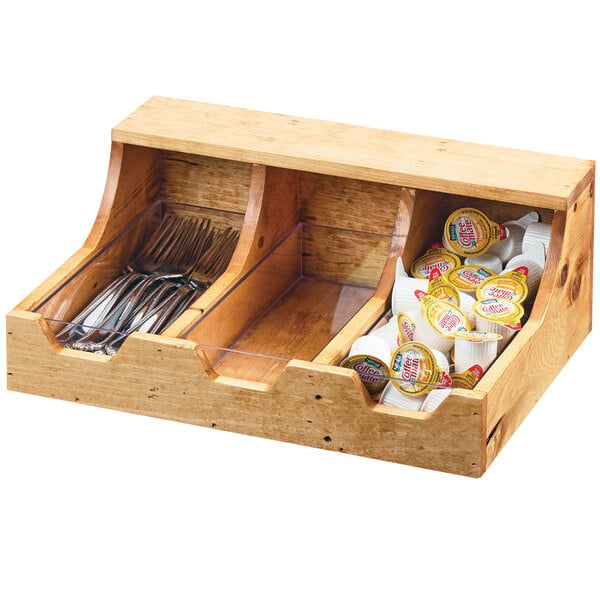 A Cal-Mil Madera wooden flatware organizer with utensils and silverware.