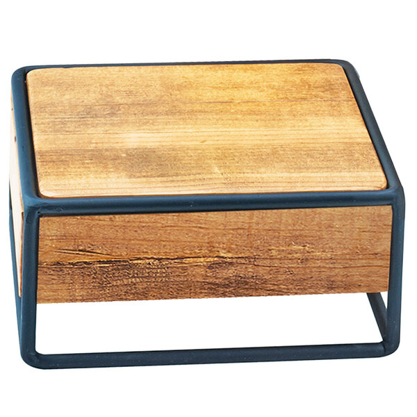A wooden square riser with black metal legs.