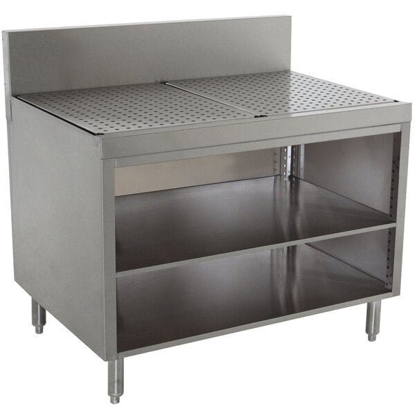 A stainless steel Advance Tabco Prestige Series drainboard cabinet with shelves.