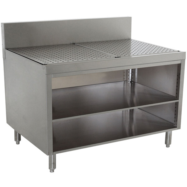 A stainless steel Advance Tabco Prestige Series drainboard cabinet with shelf.