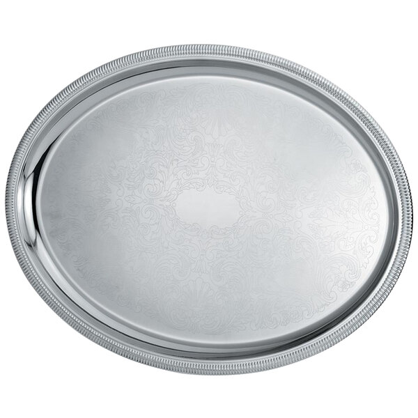 A Vollrath stainless steel oval catering tray with a design on it.