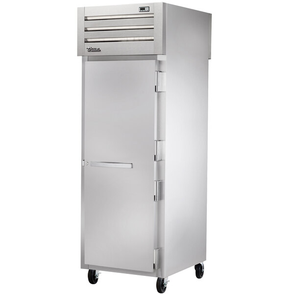 A stainless steel True pass-through heated holding cabinet with a solid door and a silver handle.