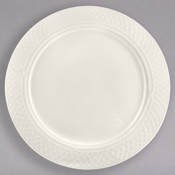 A white Homer Laughlin Ivory China plate with a circular patterned edge.