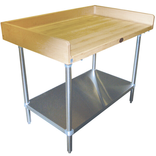 An Advance Tabco wood baker's table with a stainless steel undershelf.