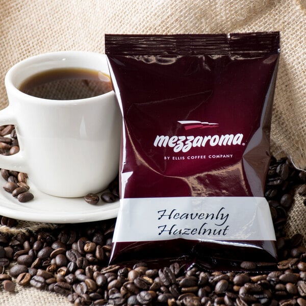 A package of Ellis Mezzaroma Heavenly Hazelnut Cream coffee next to a cup of coffee.