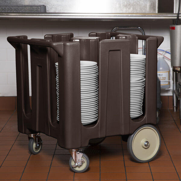 A dark brown Cambro dish cart with plates on it.